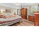 Spacious main bedroom features an elegant four-poster bed and wood floors at 1510 Asbury Church Rd, Sanford, NC 27330