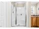 Bathroom showcases a glass-enclosed shower with a tiled showerhead and shelf at 1510 Asbury Church Rd, Sanford, NC 27330