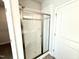 Bathroom shower featuring a glass door and bench seating at 1667 Pecan Drive # 25, Nashville, NC 27856