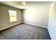 This bedroom has neutral walls and gray carpet along with a large window at 1667 Pecan Drive # 25, Nashville, NC 27856