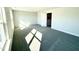 Spacious bedroom has neutral walls, grey carpet, and natural light from windows at 1667 Pecan Drive # 25, Nashville, NC 27856