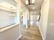 Inviting foyer with wood-look floors, neutral paint, and open sightlines to dining and living areas at 1667 Pecan Drive # 25, Nashville, NC 27856