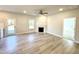 Comfortable living room with fireplace, wood-look floors, and seamless transition to the outdoor area at 1667 Pecan Drive # 25, Nashville, NC 27856