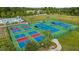 Aerial view of community tennis courts, showcasing multiple well-maintained courts and surrounding green spaces at 1910 Morehead Hill Ct, Durham, NC 27703