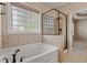 Bright bathroom with soaking tub and glass-enclosed shower at 1910 Morehead Hill Ct, Durham, NC 27703