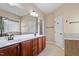Bathroom featuring double vanity and large mirror at 1910 Morehead Hill Ct, Durham, NC 27703