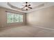 Large bedroom with trey ceiling and natural light at 1910 Morehead Hill Ct, Durham, NC 27703