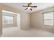 Spacious bedroom featuring neutral walls, carpeting, and natural light streaming through windows, creating a cozy atmosphere at 1910 Morehead Hill Ct, Durham, NC 27703