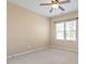 A bright bedroom features neutral walls, carpeted floors, and a window, offering a serene and comfortable living space at 1910 Morehead Hill Ct, Durham, NC 27703