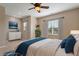 Bedroom with ceiling fan, window, and ample natural light at 1910 Morehead Hill Ct, Durham, NC 27703