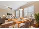 Open-concept dining and living area with hardwood floors and natural lighting at 1910 Morehead Hill Ct, Durham, NC 27703