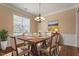 Dining room featuring modern chandelier and six-person dining table at 1910 Morehead Hill Ct, Durham, NC 27703
