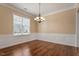 Dining room with natural light, crown molding, and hardwood floors at 1910 Morehead Hill Ct, Durham, NC 27703