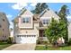 Inviting two-story home with a two-car garage and manicured lawn at 1910 Morehead Hill Ct, Durham, NC 27703