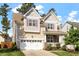 Attractive two-story home with a two car garage, well-maintained lawn, and a welcoming front porch at 1910 Morehead Hill Ct, Durham, NC 27703