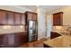 Kitchen featuring stainless steel appliances, granite countertops, and wood cabinetry at 1910 Morehead Hill Ct, Durham, NC 27703