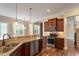 Kitchen featuring stainless steel appliances, granite countertops, and hardwood floors at 1910 Morehead Hill Ct, Durham, NC 27703