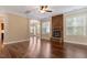 Open living space with hardwood floors, stone fireplace, and abundant natural light at 1910 Morehead Hill Ct, Durham, NC 27703