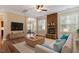 Bright living room with stone fireplace, hardwood floors, and modern decor at 1910 Morehead Hill Ct, Durham, NC 27703
