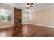 Spacious living room with hardwood floors and a stone fireplace at 1910 Morehead Hill Ct, Durham, NC 27703