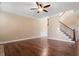 Open living room featuring hardwood floors and staircase at 1910 Morehead Hill Ct, Durham, NC 27703