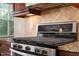 Gourmet kitchen featuring stainless steel stove and granite countertops at 1910 Morehead Hill Ct, Durham, NC 27703