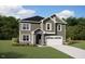 Charming two-story home featuring a well-manicured lawn and an attached two-car garage at 192 Sargents St, Garner, NC 27529