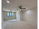 Spacious room with neutral walls, ceiling fan and three large windows offering ample light at 200 Broadleaf Ln, Louisburg, NC 27549