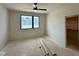 Bright bedroom with a ceiling fan, and a large window offering natural light at 200 Broadleaf Ln, Louisburg, NC 27549