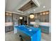 Spacious kitchen with a large center island, custom cabinets, and designer lighting at 200 Broadleaf Ln, Louisburg, NC 27549
