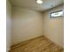 Compact room with hardwood floors, a small window, and light fixtures at 200 Broadleaf Ln, Louisburg, NC 27549