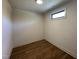 Unfinished basement area with wood floor and window offering customization potential at 200 Broadleaf Ln, Youngsville, NC 27596
