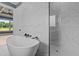 This bathroom features a standalone soaking tub and tiled shower with glass door at 200 Broadleaf Ln, Youngsville, NC 27596