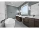 This bathroom features a standalone soaking tub and double sink vanity at 200 Broadleaf Ln, Youngsville, NC 27596