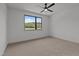Spacious bedroom with a ceiling fan and a large window with a view of nature at 200 Broadleaf Ln, Youngsville, NC 27596