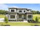 Attractive two-story home with stone accents, manicured lawn, and professional landscaping at 200 Broadleaf Ln, Youngsville, NC 27596