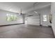 Spacious three-car garage interior with side door and windows at 200 Broadleaf Ln, Youngsville, NC 27596