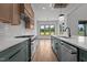 Open concept kitchen featuring a large island, professional appliances, and hardwood floors at 200 Broadleaf Ln, Youngsville, NC 27596