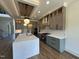 Stylish kitchen with a large island, stainless steel appliances, and light wood flooring at 200 Broadleaf Ln, Youngsville, NC 27596