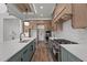 Gourmet kitchen featuring a large island, professional appliances, and hardwood floors at 200 Broadleaf Ln, Youngsville, NC 27596