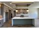 Modern kitchen with a large island, stainless steel appliances, and stylish pendant lighting at 200 Broadleaf Ln, Youngsville, NC 27596