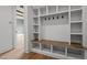Built-in mudroom with seating, storage and hooks at 200 Broadleaf Ln, Youngsville, NC 27596