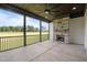 Screened patio featuring a stone fireplace with a view of the lawn at 200 Broadleaf Ln, Youngsville, NC 27596