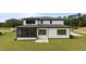 Exterior rear of house shows patio, siding, and multiple windows at 200 Broadleaf Ln, Youngsville, NC 27596