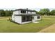 Exterior rear of house shows patio, siding, and multiple windows at 200 Broadleaf Ln, Youngsville, NC 27596