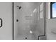 This shower has gray tile, a glass enclosure, and a built-in seat at 200 Broadleaf Ln, Youngsville, NC 27596