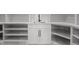 Stylish wet bar with a sink, cabinet, counter space and open shelving at 200 Broadleaf Ln, Youngsville, NC 27596
