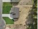 Aerial view of a two-story home with a three-car garage, a large driveway, and a landscaped yard at 203 Great Smoky Pl, Lillington, NC 27546