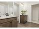 Bathroom with dual sink vanity with dark wood cabinets, white countertop and modern fixtures at 203 Great Smoky Pl, Lillington, NC 27546