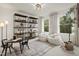 Light filled spare bedroom with cozy seating, bright windows and stylish decor at 203 Great Smoky Pl, Lillington, NC 27546
